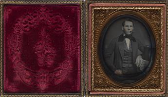 (CASED IMAGES) A quarter-plate daguerreotype of a handsome man wearing a fur top hat and a floral vest.